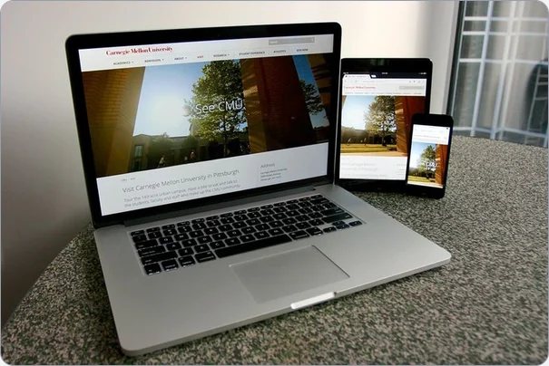 The Carnegie Mellon website on a laptop, tablet, and phone